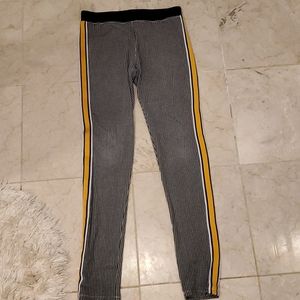 Pants with black-and-white checkers and a yellow m